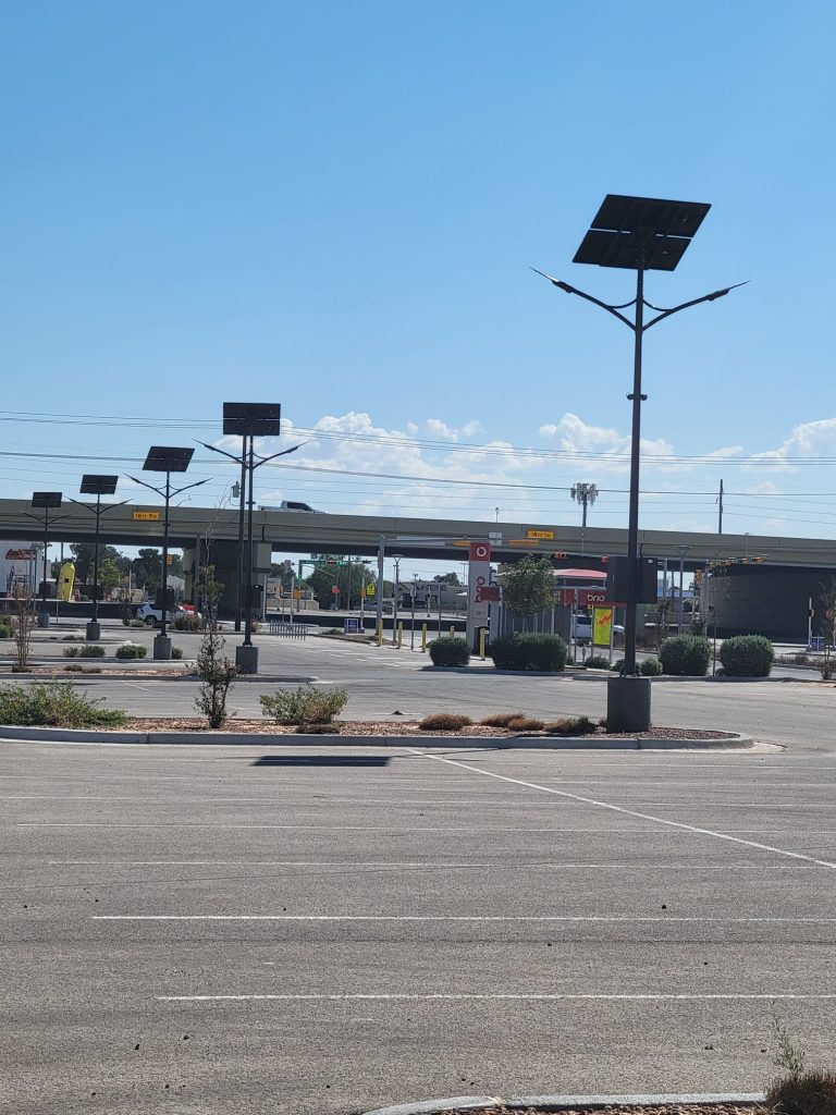 SolarPath dual-arm solar parking lot lights at a commercial site in El Paso, Texas